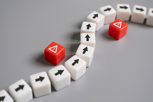 Arrow,Avoid,Risk,Warning,Sign,On,Red,Cube,With,Copy